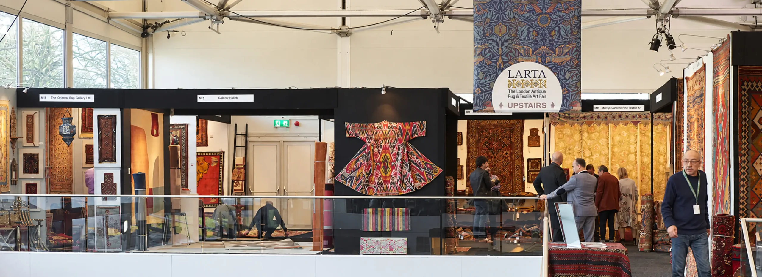 Collectors looking at carpets at LARTA